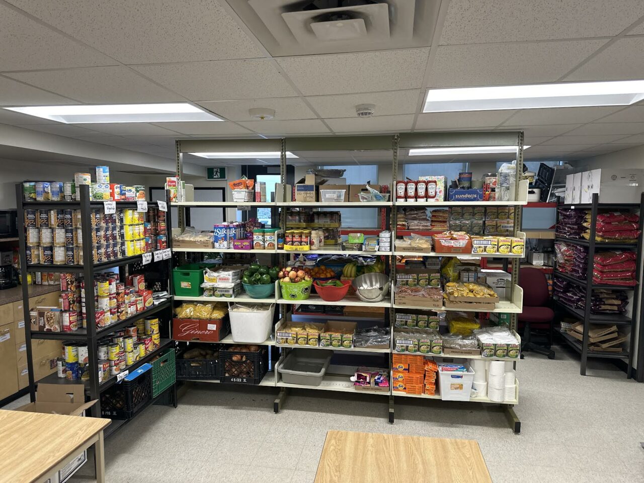 Shelves filled with non perishable foods.